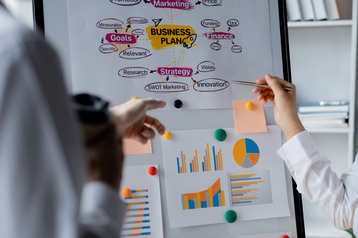 The sales department is having a monthly summary meeting to bring it to the department manager, they are verifying the correctness of the documents that are prepared before bringing in to the manager