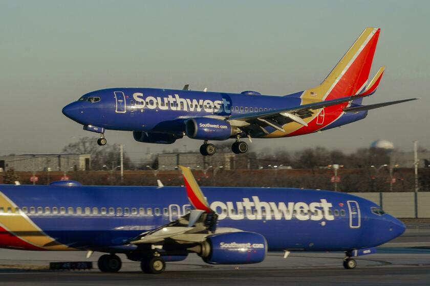 Two Southwest Airlines planes on a tarmac, representing the strategic trade-off of choosing low-cost positioning over traditional airline luxury.