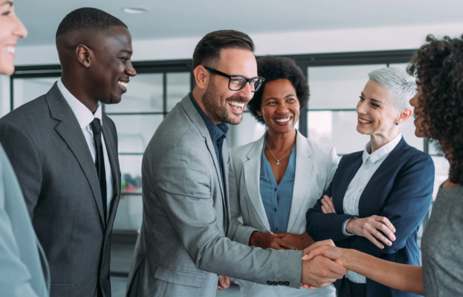 A business team collaborating in an office, illustrating the internal alignment needed to turn market research into a successful brand strategy.