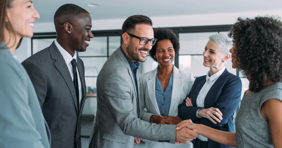 A business team collaborating in an office, illustrating the internal alignment needed to turn market research into a successful brand strategy.
