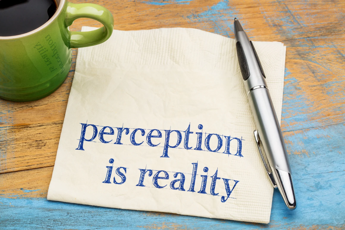 Handwritten note reading perception is reality, emphasizing the impact of a company's external image.